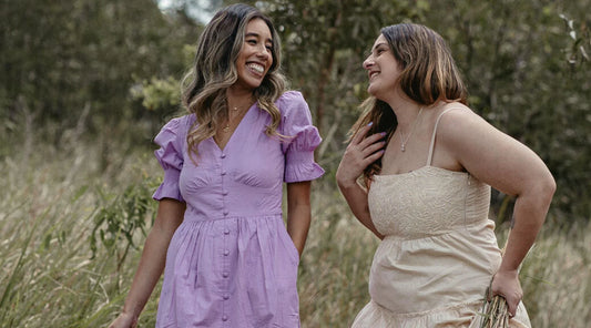 Two females in a farm wearing indi dresses with pockets