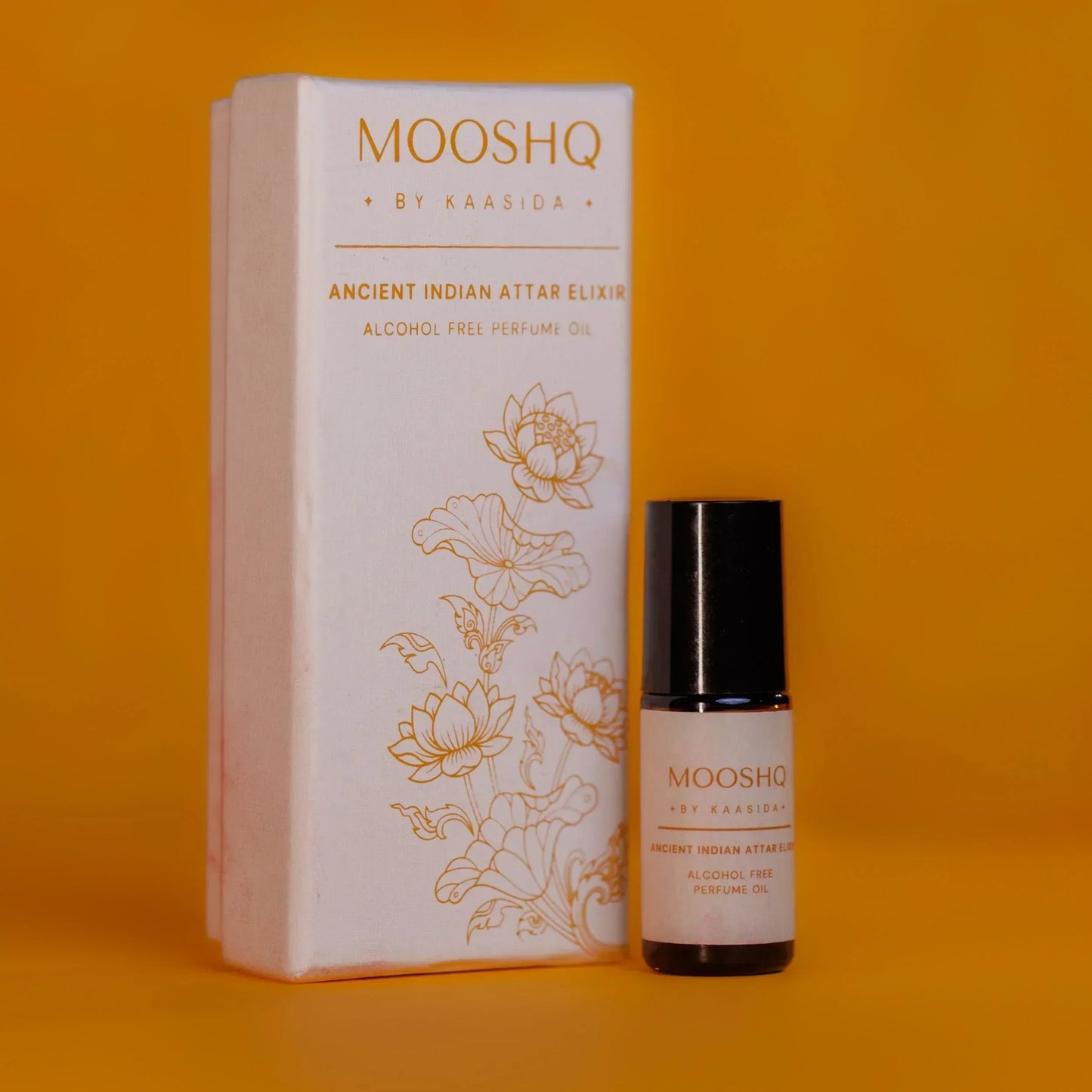 MOOSHQ by Kaasida perfume 5 ML bottle and packaging on an orange background