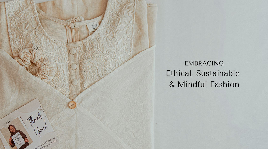 Hand embroidered linen top placed on a white table with text on the side that reads "embracing ethical, sustainable & mindful fashion"